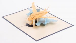 Pop up greeting card: A 3D model of a jet flying through clouds.