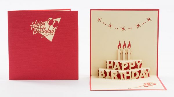 Pop up birthday card: A two tier cake with happy birthday and three candles