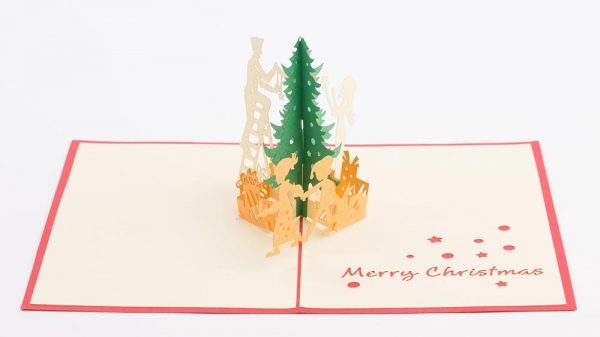 3D pop up greeting cards , Card open showing a 3d scene of parents with children decorating a Christmas tree