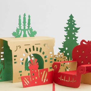 3D pop up greeting cards,Card open with a 3D scene with a fireplace chair and Christmas tree.close up