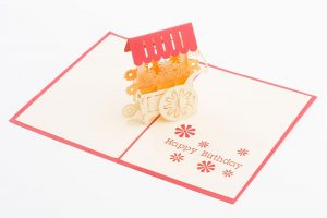 3D pop up card, Card open with a 3D model of a cart full of flowers.