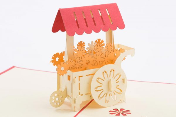 3D pop up card, Card open with a 3D model of a cart full of flowers.