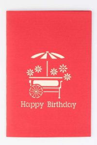 Cover of card with image of cart with flowers