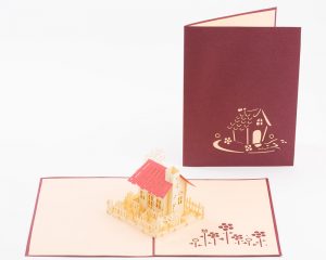 3D pop up greeting cards, card open showing a model of a house complete with scene.