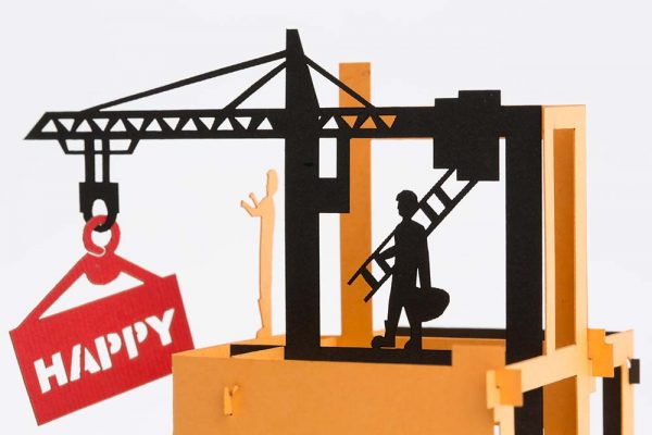 3D pop up greeting card: Happy birthday card open with a 4 story construction site with a crane and workers.