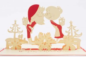 3D pop up greeting cards, Card open Mr and Mrs Clause pop up kissing with gifts, trees and snowflakes.