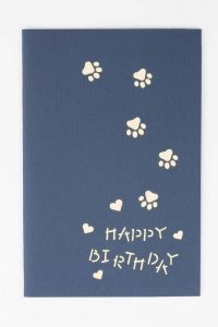 Cover of card, paw marks with Happy Birthday across card.