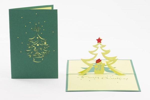 3D pop up greeting cards,Card open showing a pop up scene of a jolly snowman under a tree. cover and open