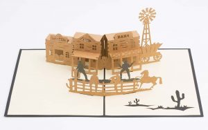 Wild West 3D pop up greeting card: Old west town with a saloon,bank,hotel, a gunfight and horses.(Card open)