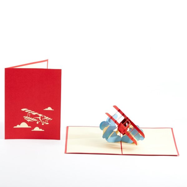 Plane 3D pop up greeting card: A red biplane flying out of clouds is popped up.