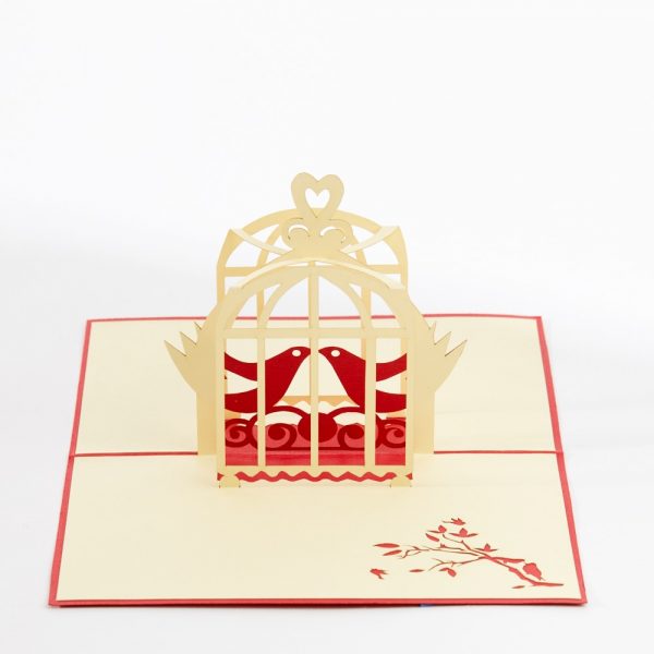Love pop up greeting card: Two birds in a cage kissing.