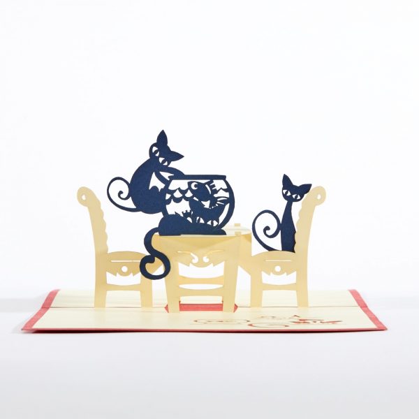 Cats pop up greeting card: Two cats sitting around a table with one cat pawing at the fish bowl.Red.