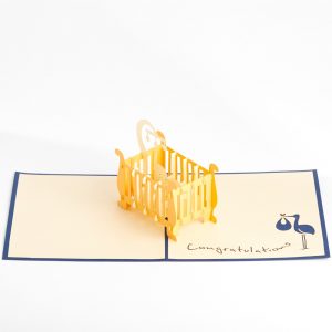 Baby 3D pop up card: A crib with a child inside popped up with blue.