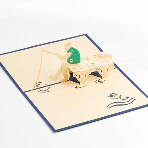 Fishing pop up greeting card: A angler sitting on a bench fishing.