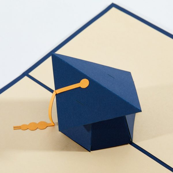 Graduation pop up greeting card: A blue graduate cap with yellow tassel. popped up.