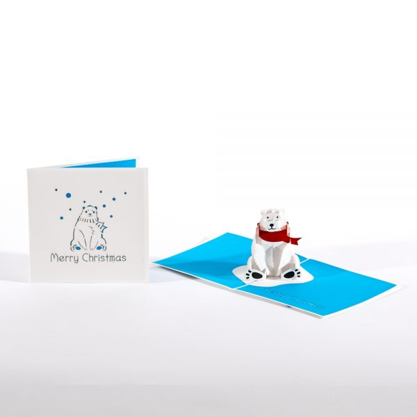 Pop up card. Polar bear wearing a red scarf pops up with Merry Christmas.